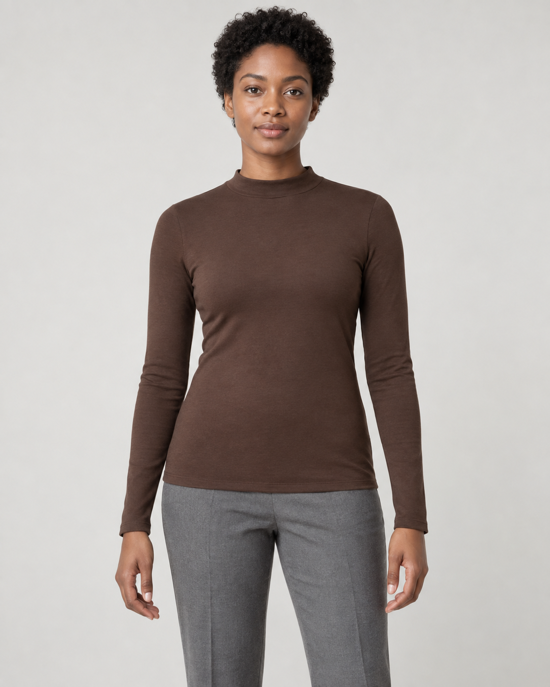Concept mockup: Akumi Contour Mock Neck Long Sleeve in Cocoa, front view on an adult woman.