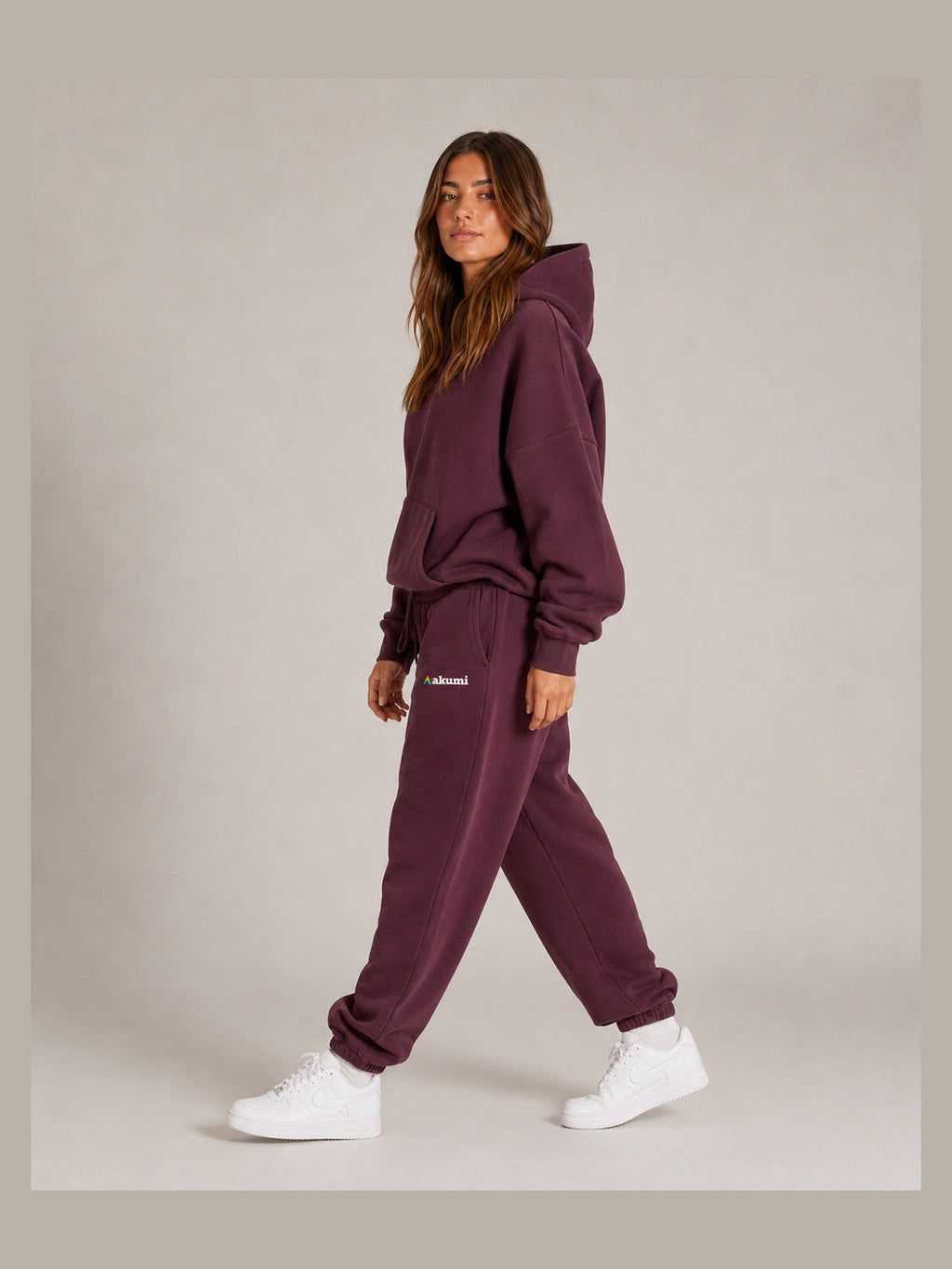 Akumi After Class Sweatpant in Mulberry, female model walking side view