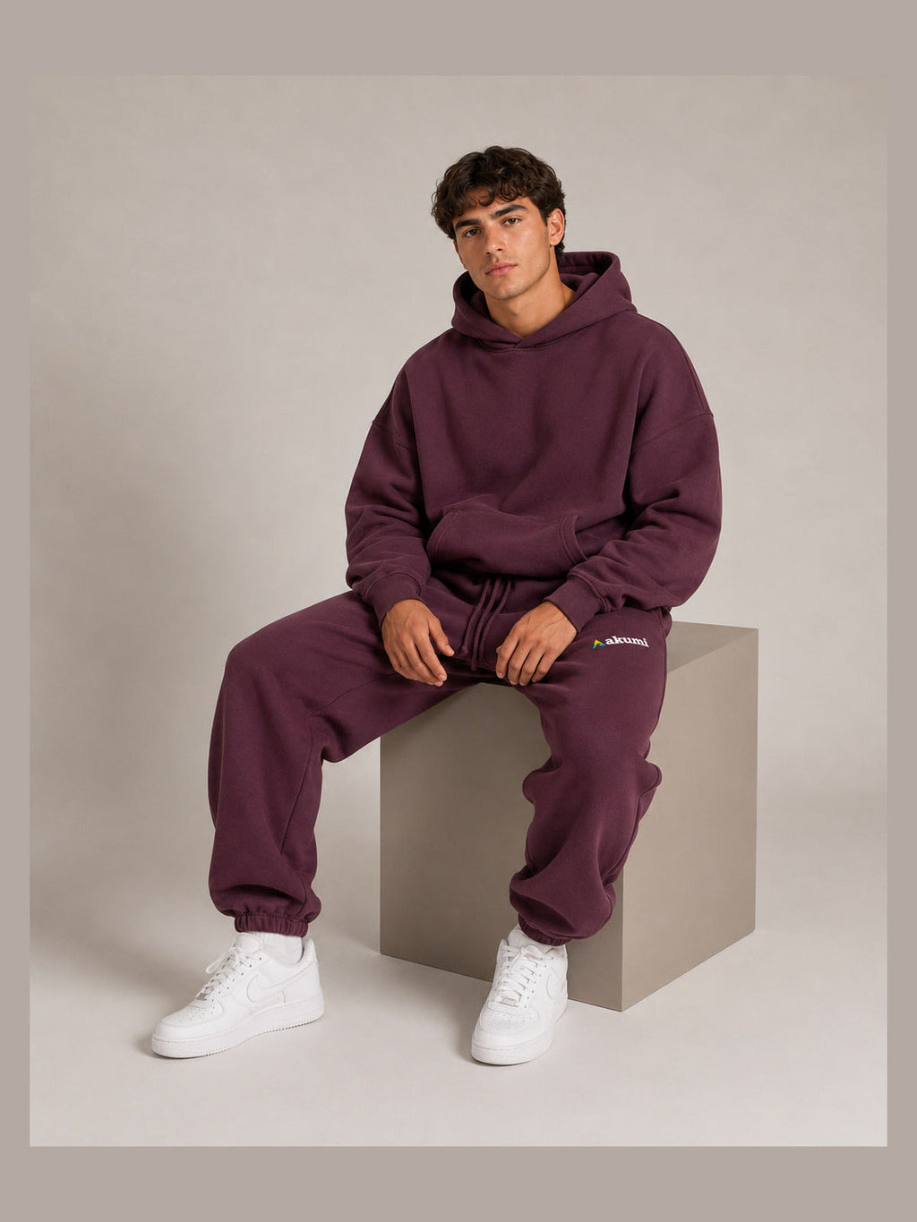 Akumi After Class Sweatpant in Mulberry, male model seated view