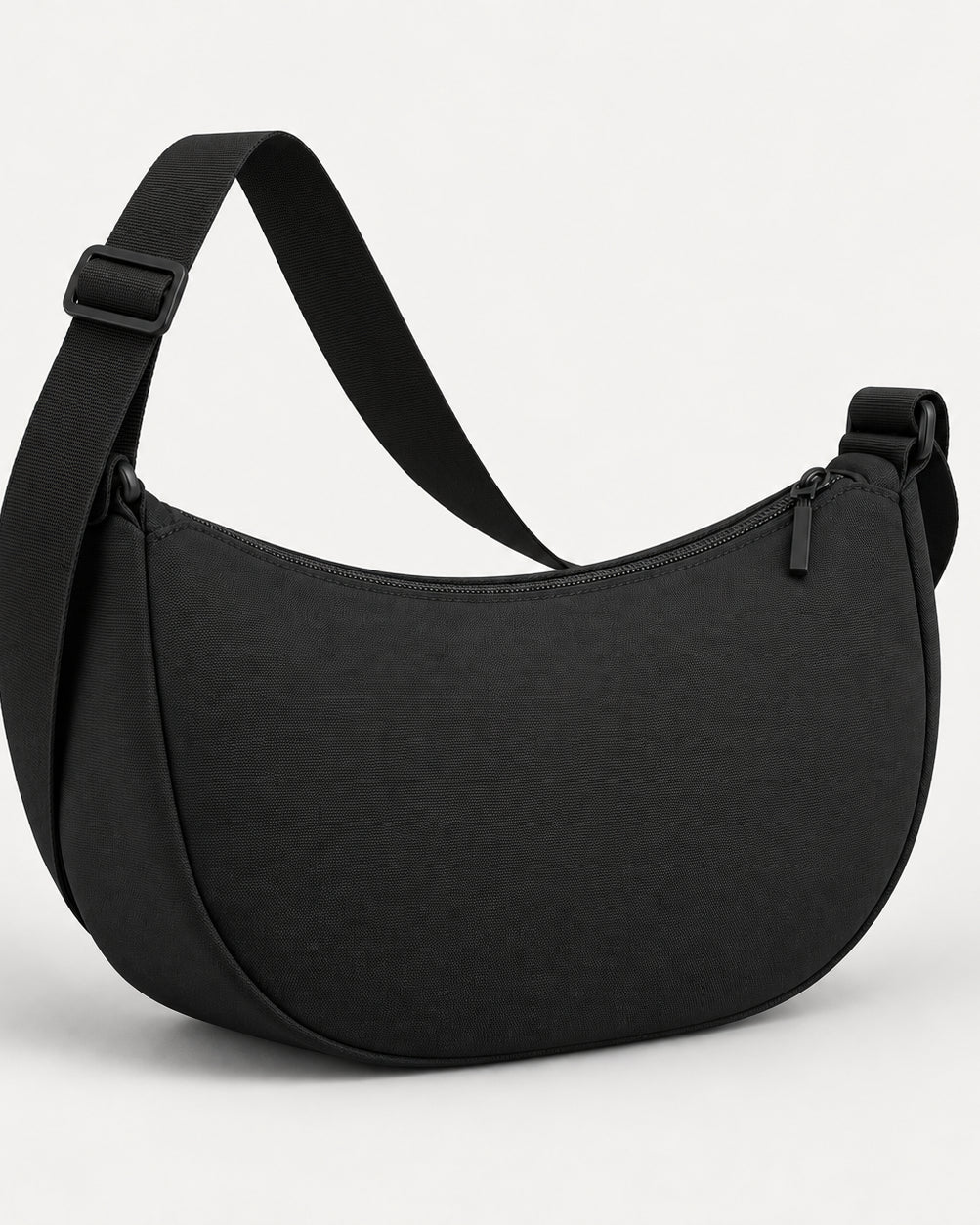 Akumi Arc Crossbody in Black, rear studio concept visualization; proposed design pending sample confirmation.