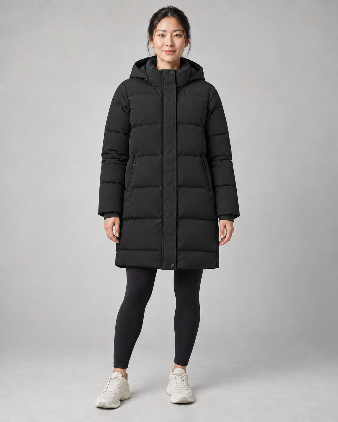 AI-generated design concept: Akumi Arc Longline Puffer in Onyx, front view.