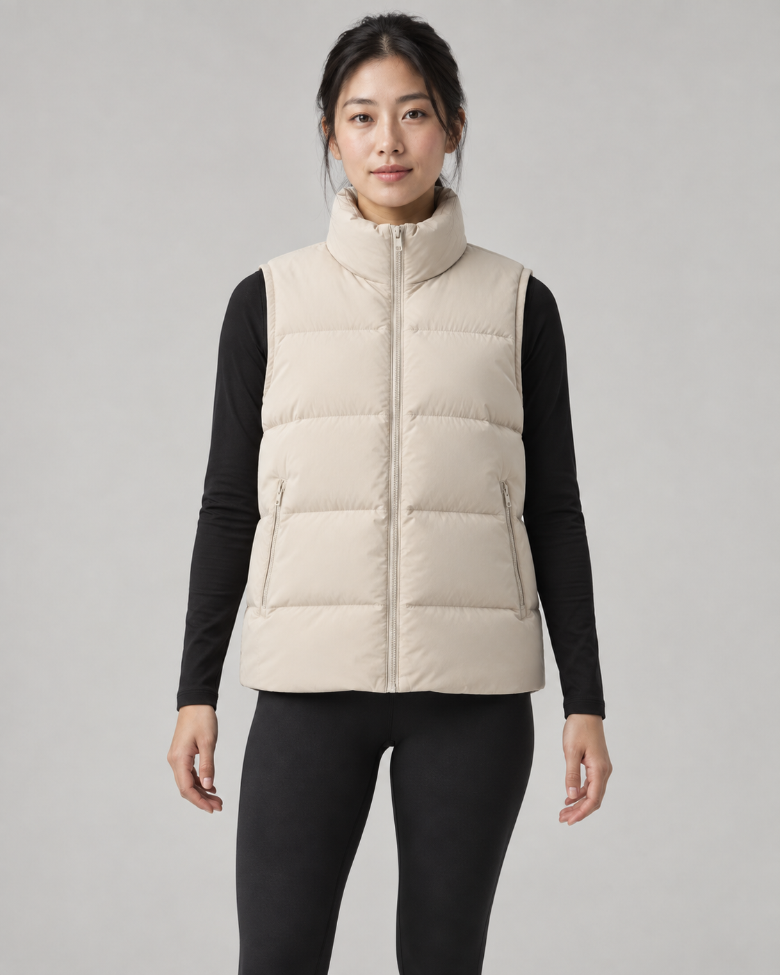 AI-generated design concept: Akumi Arc Puffer Vest in Oat, front view on an adult woman.