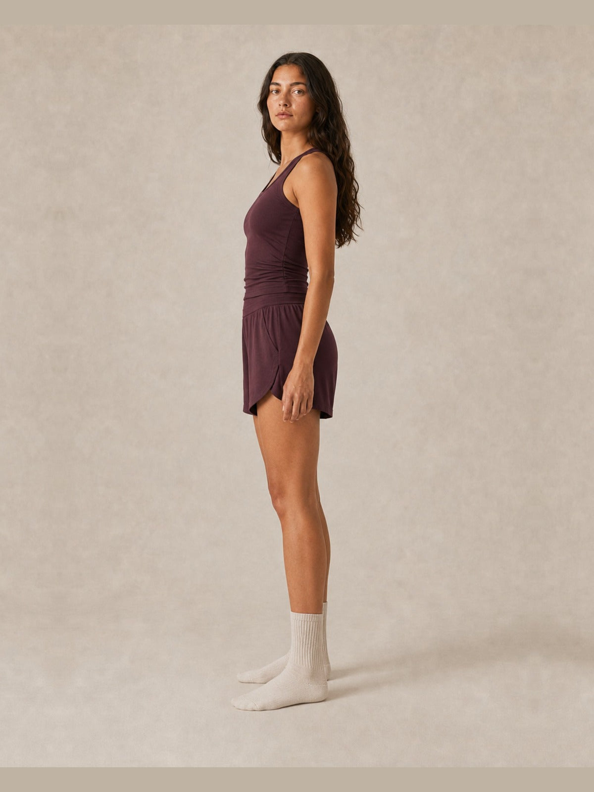 Akumi Arcflow Lounge Short in Deep Fig, women’s side profile