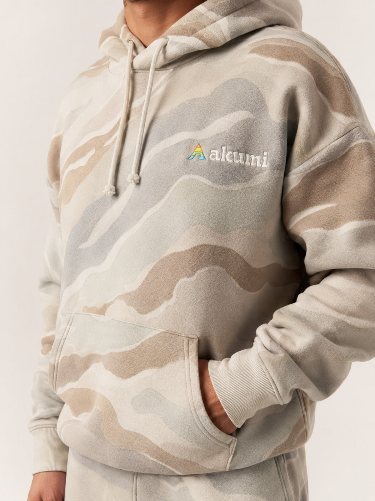 Akumi Terrainwash Hoodie in Bone Terrain raised embroidery and kangaroo pocket detail