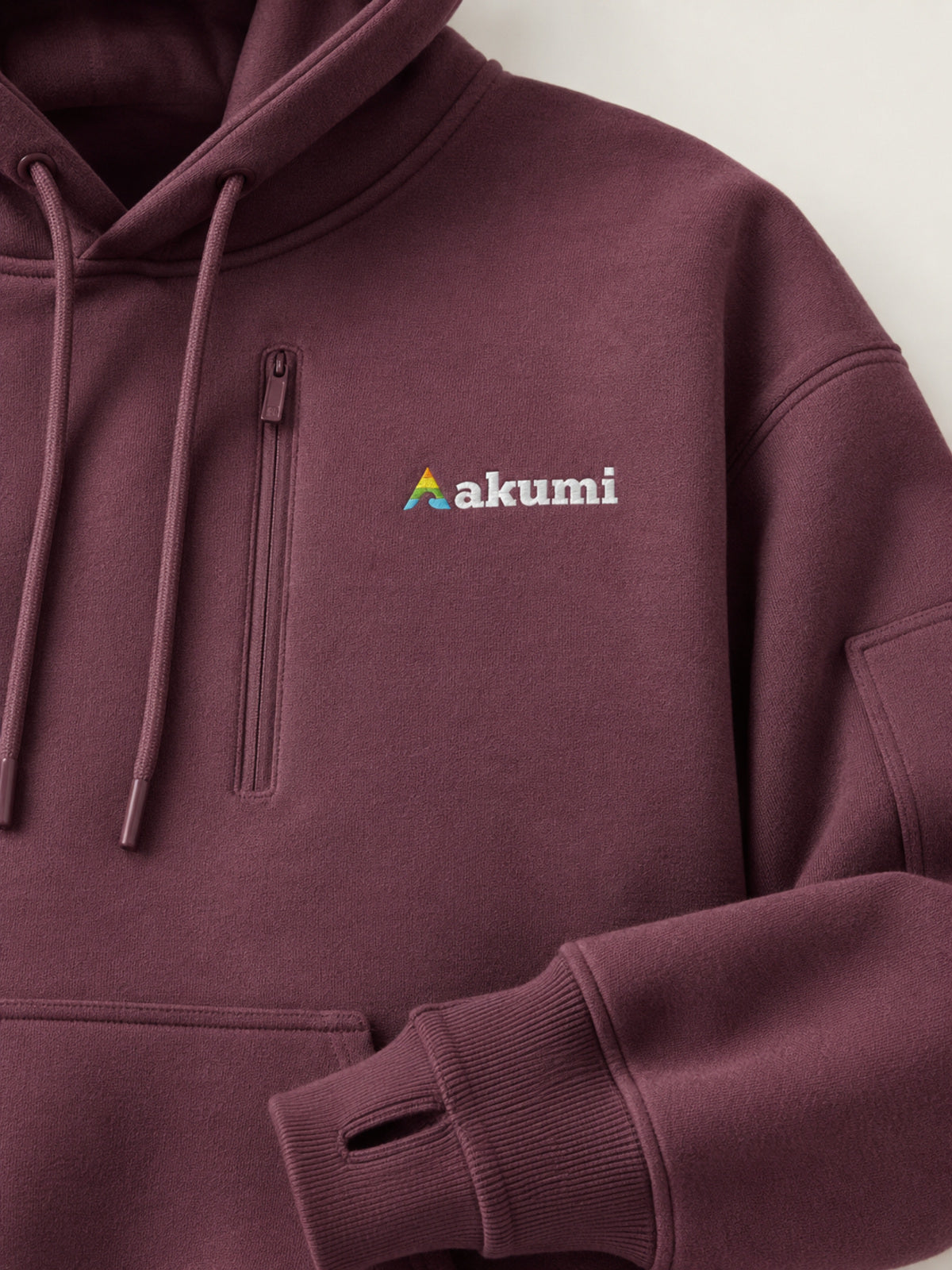 Akumi Cacheline Utility Hoodie in Blackberry Clay logo and utility pocket detail