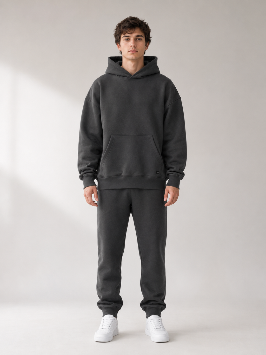 Front view of Akumi Collegiate Motion Hoodie in charcoal