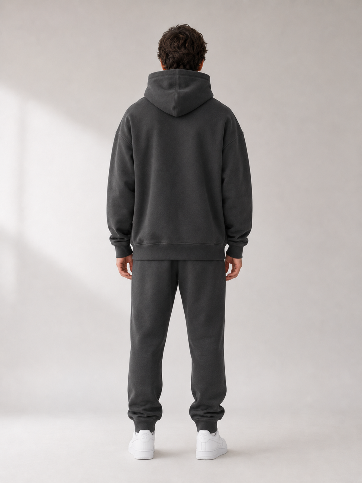 Back view of Akumi Collegiate Motion Hoodie in charcoal