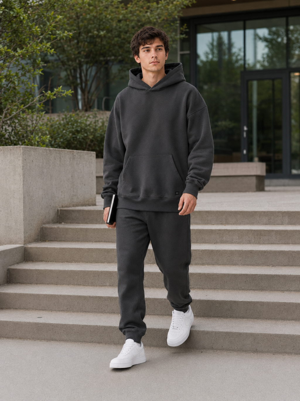 Akumi Collegiate Motion Hoodie worn outdoors on a modern campus