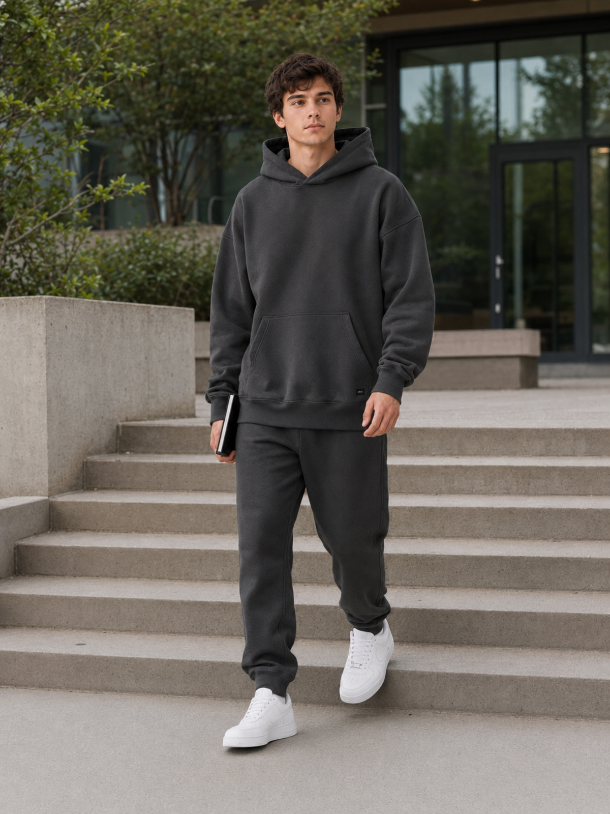Akumi Collegiate Motion Hoodie worn outdoors on a modern campus