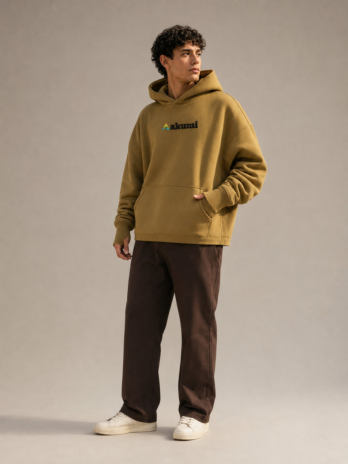 Akumi Crestline Hoodie in Golden Moss — men's full-body front view
