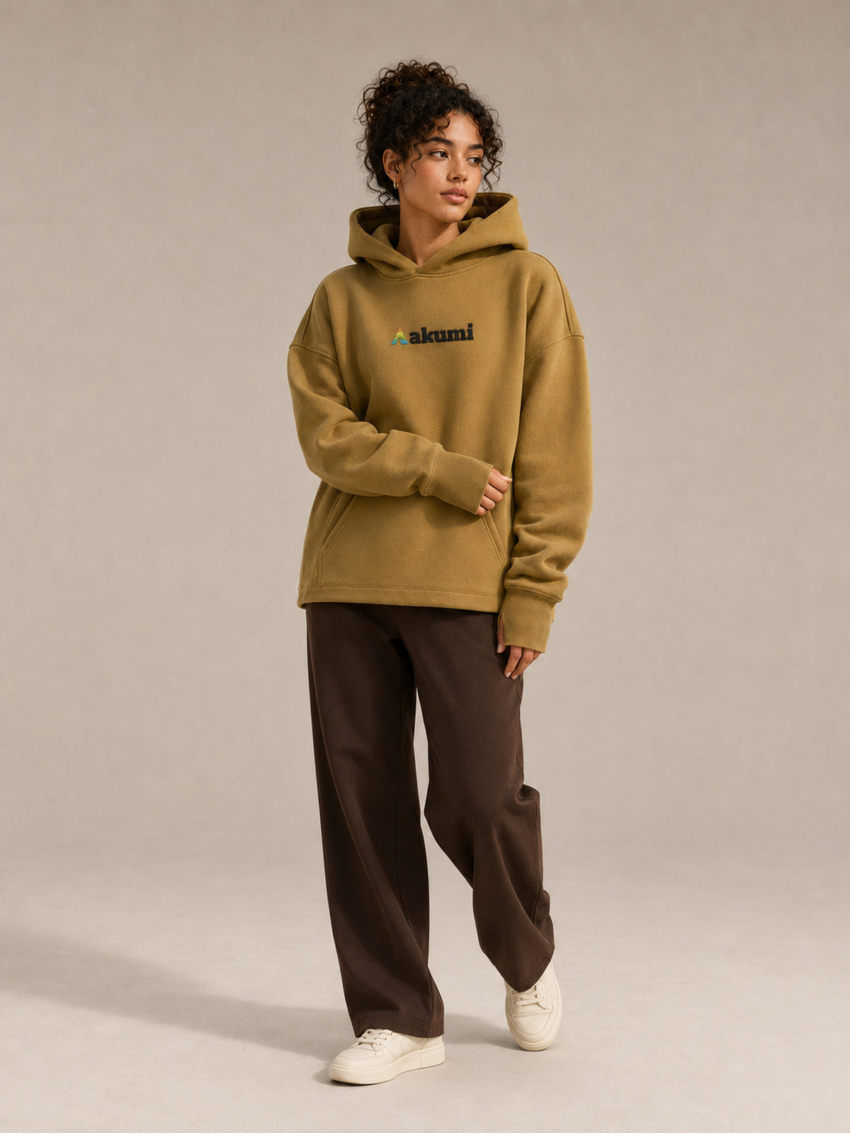 Akumi Crestline Hoodie in Golden Moss — women's full-body view