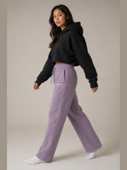 Akumi Crestline Straight-Leg Sweatpant in Lilac Smoke, female model side walking view