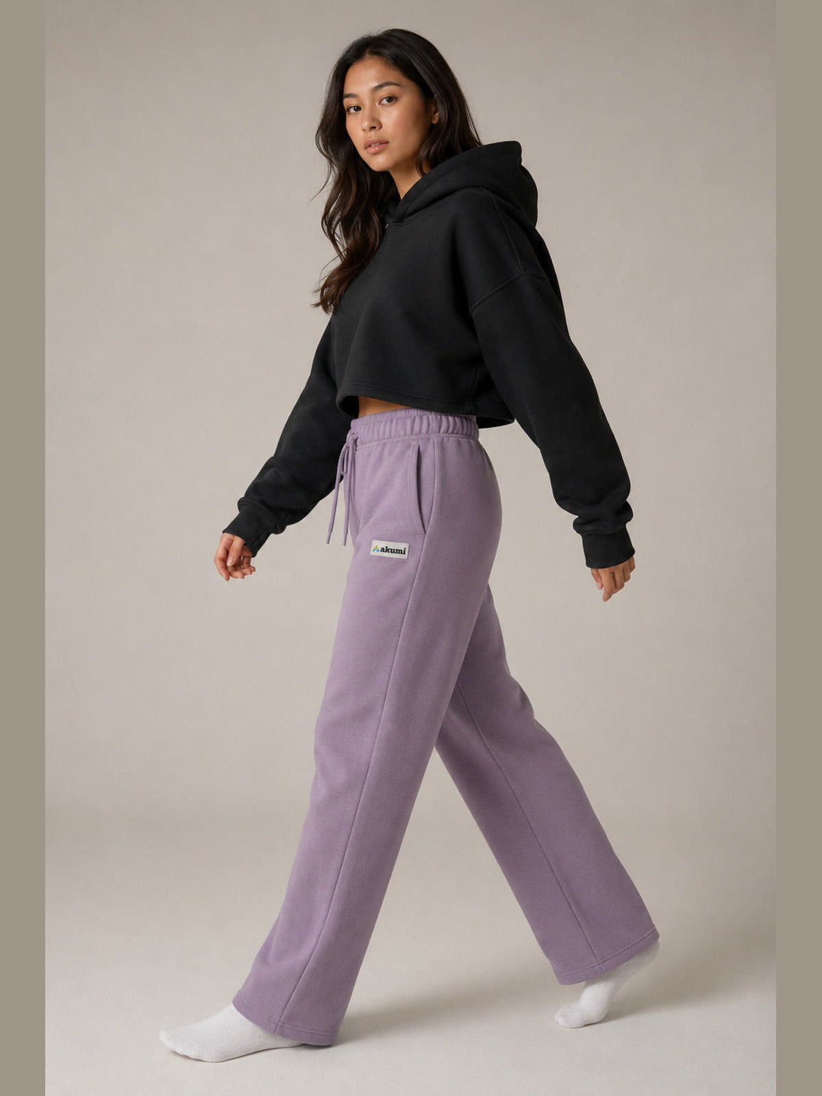 Akumi Crestline Straight-Leg Sweatpant in Lilac Smoke, female model side walking view