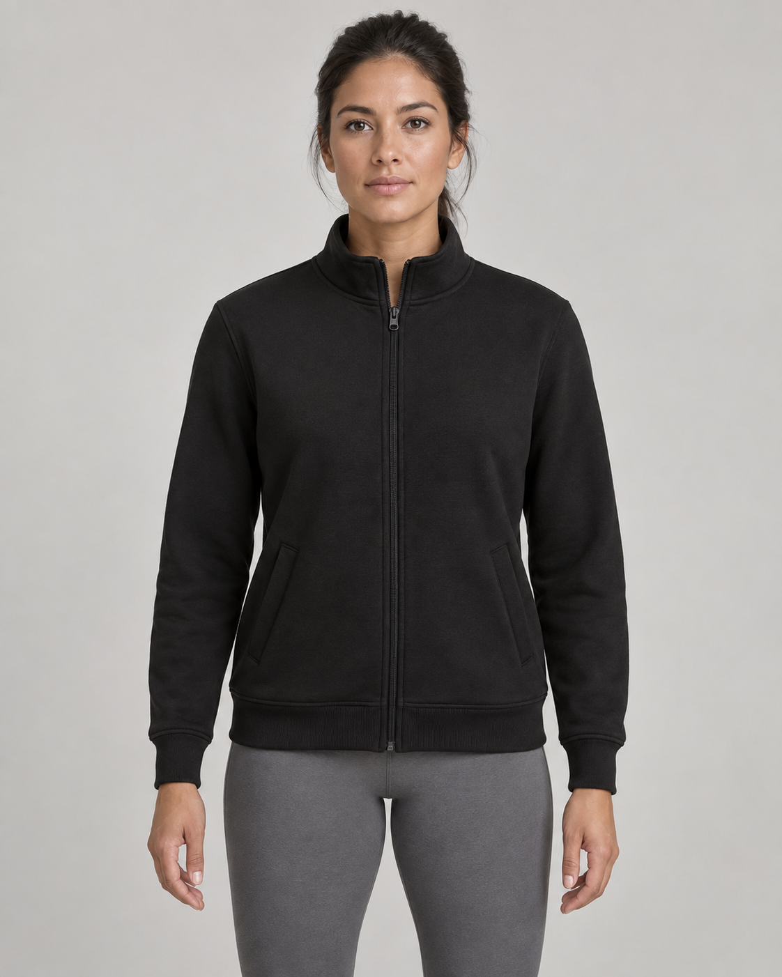 AI-generated design concept: woman wearing the proposed Daybreak Stand-Collar Zip in Onyx, front view.
