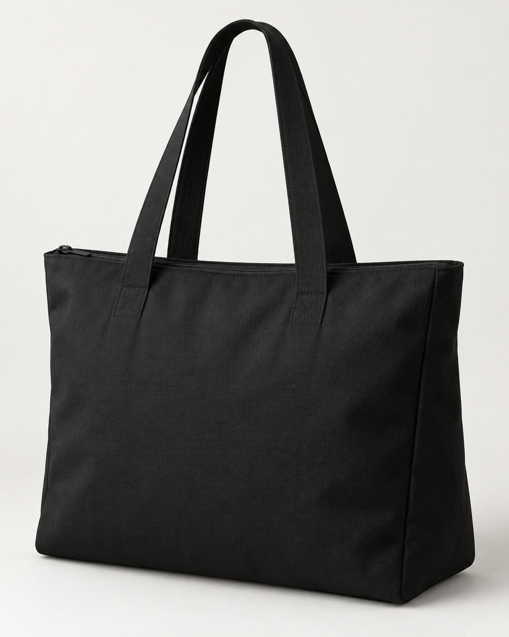 Akumi Dayform Tote in Black, front three-quarter studio concept visualization.