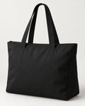 Akumi Dayform Tote in Black, front three-quarter studio concept visualization.