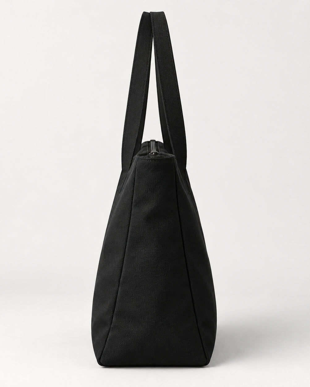 Akumi Dayform Tote in Black, right-side profile studio concept visualization; proposed design pending sample confirmation.