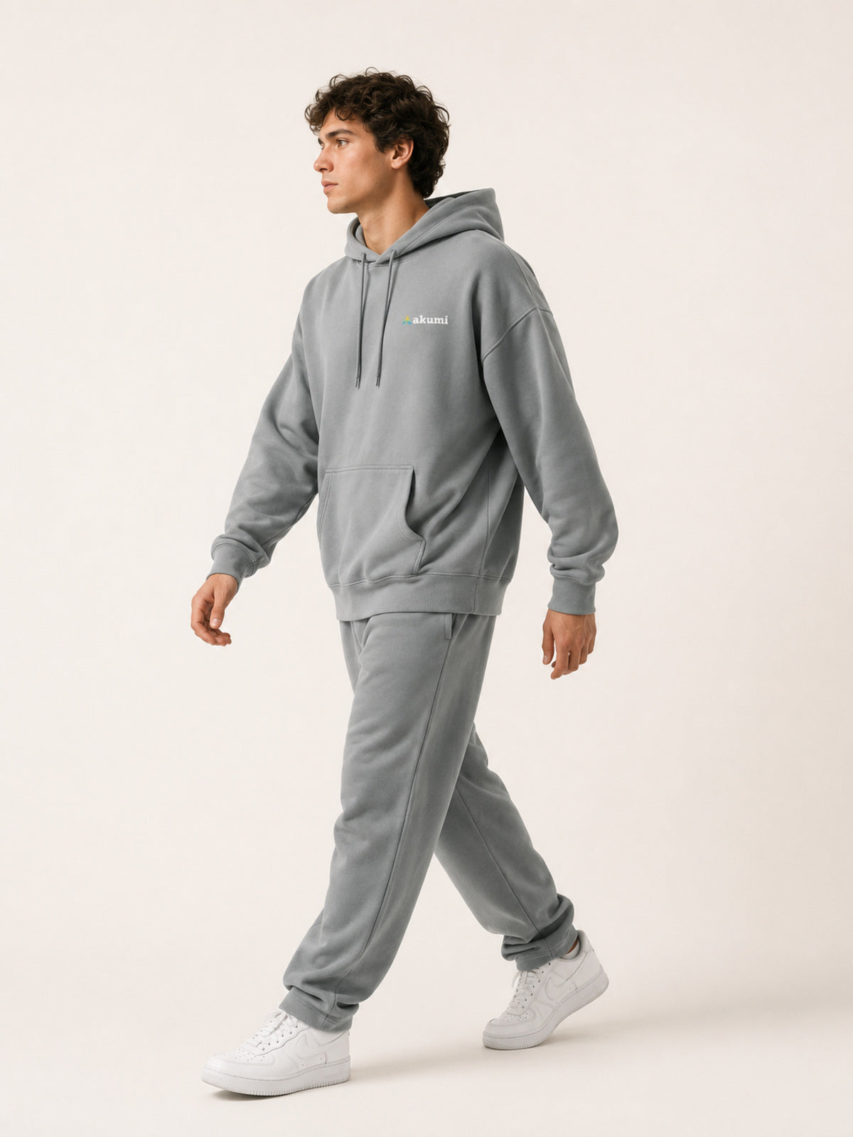 Akumi Driftline Lightweight Hoodie in Canyon Fog, side walking studio view