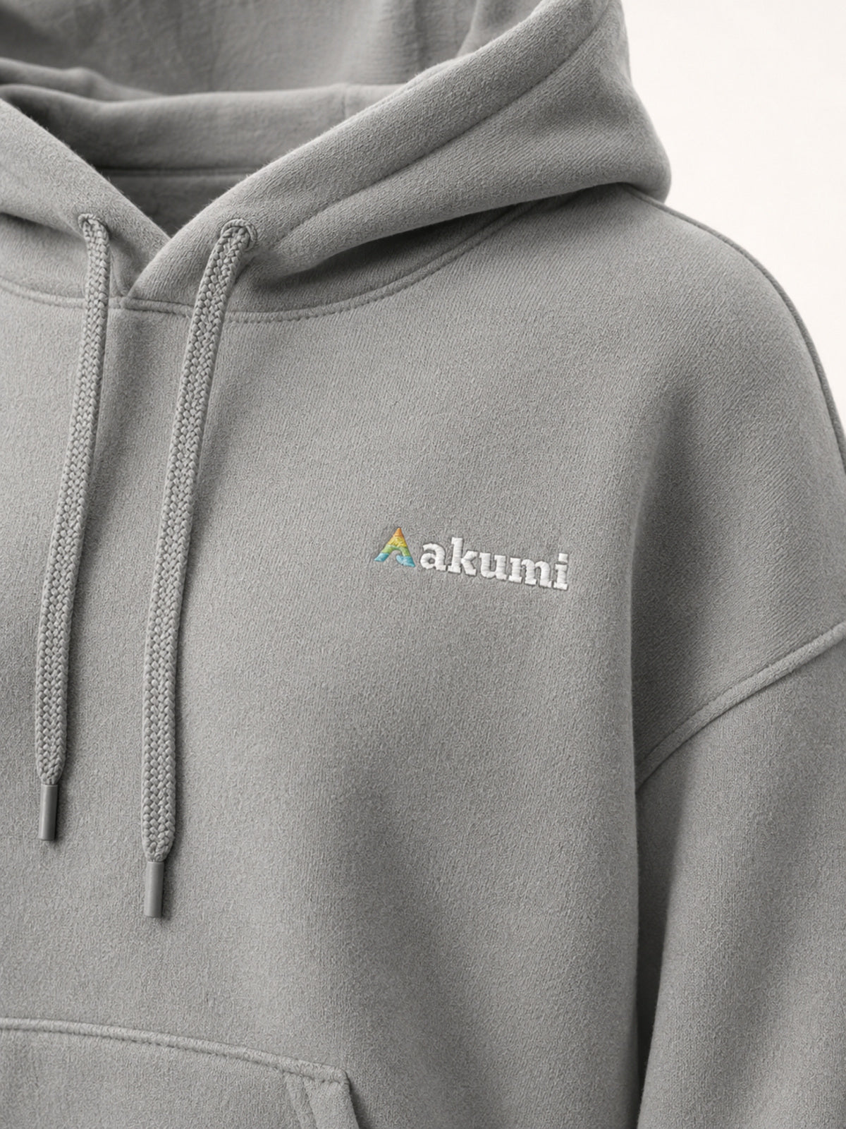 Akumi Driftline Lightweight Hoodie in Canyon Fog, embroidered logo and fleece texture detail