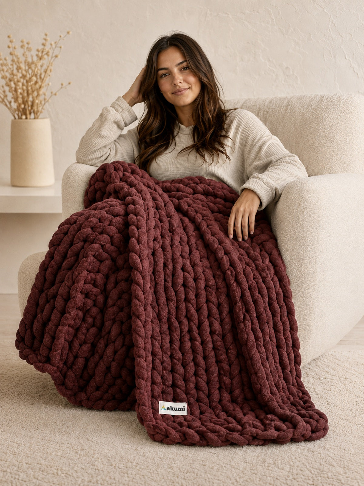 Akumi Emberloop Weighted Blanket Mulberry Clay hero view with sewn woven hem label