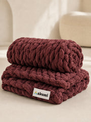 Akumi Emberloop Weighted Blanket Mulberry Clay folded view with sewn woven hem label