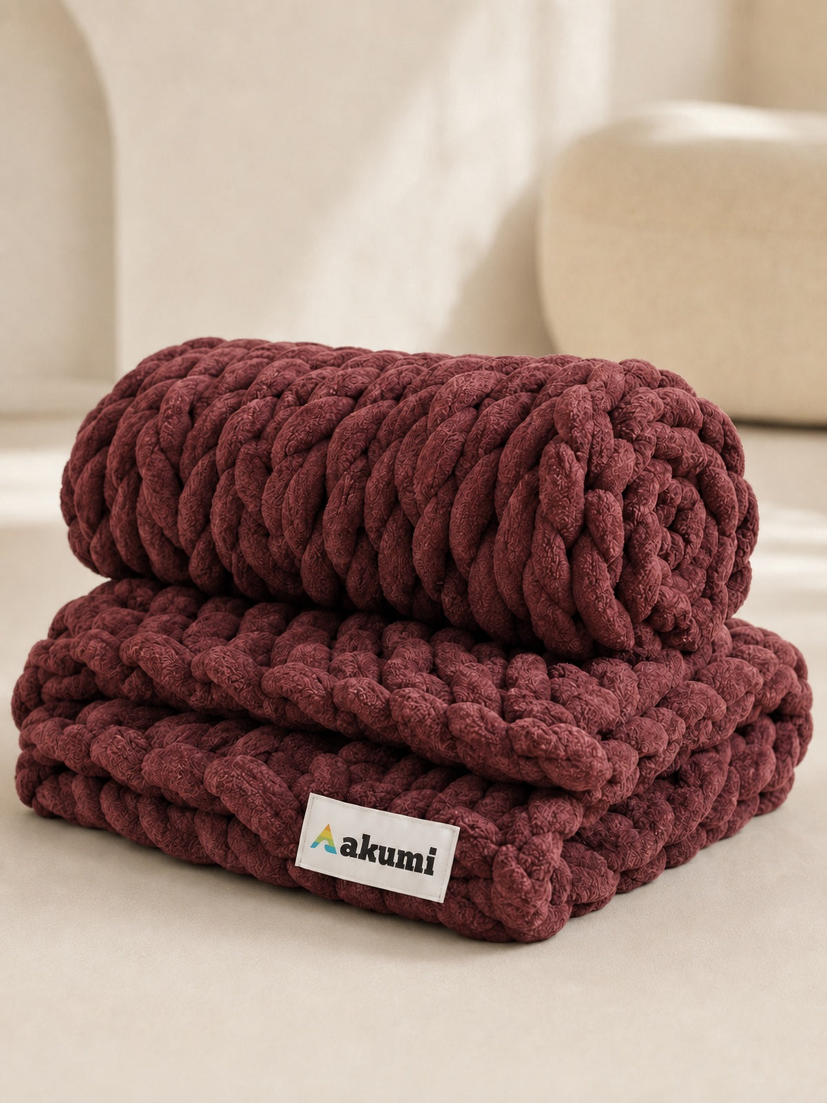 Akumi Emberloop Weighted Blanket Mulberry Clay folded view with sewn woven hem label
