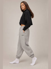 Akumi Fieldmark Jogger Sweatpant in Stadium Grey, female model side walking view