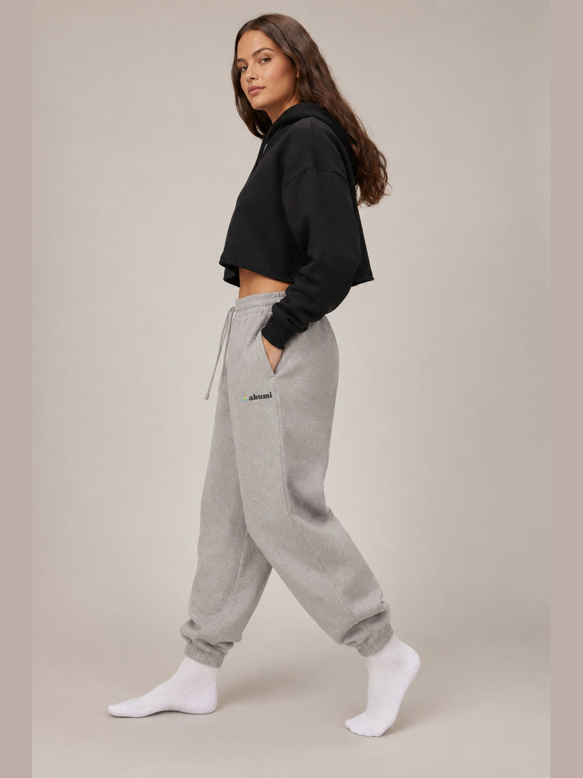 Akumi Fieldmark Jogger Sweatpant in Stadium Grey, female model side walking view