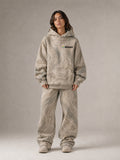 Akumi Fieldwave Hoodie in Stonebrush, female front hero with embroidered Akumi logo