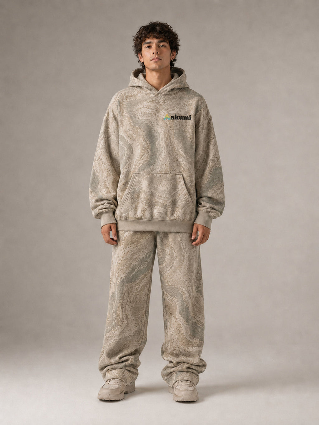 Akumi Fieldwave Hoodie in Stonebrush, male front view with embroidered Akumi logo