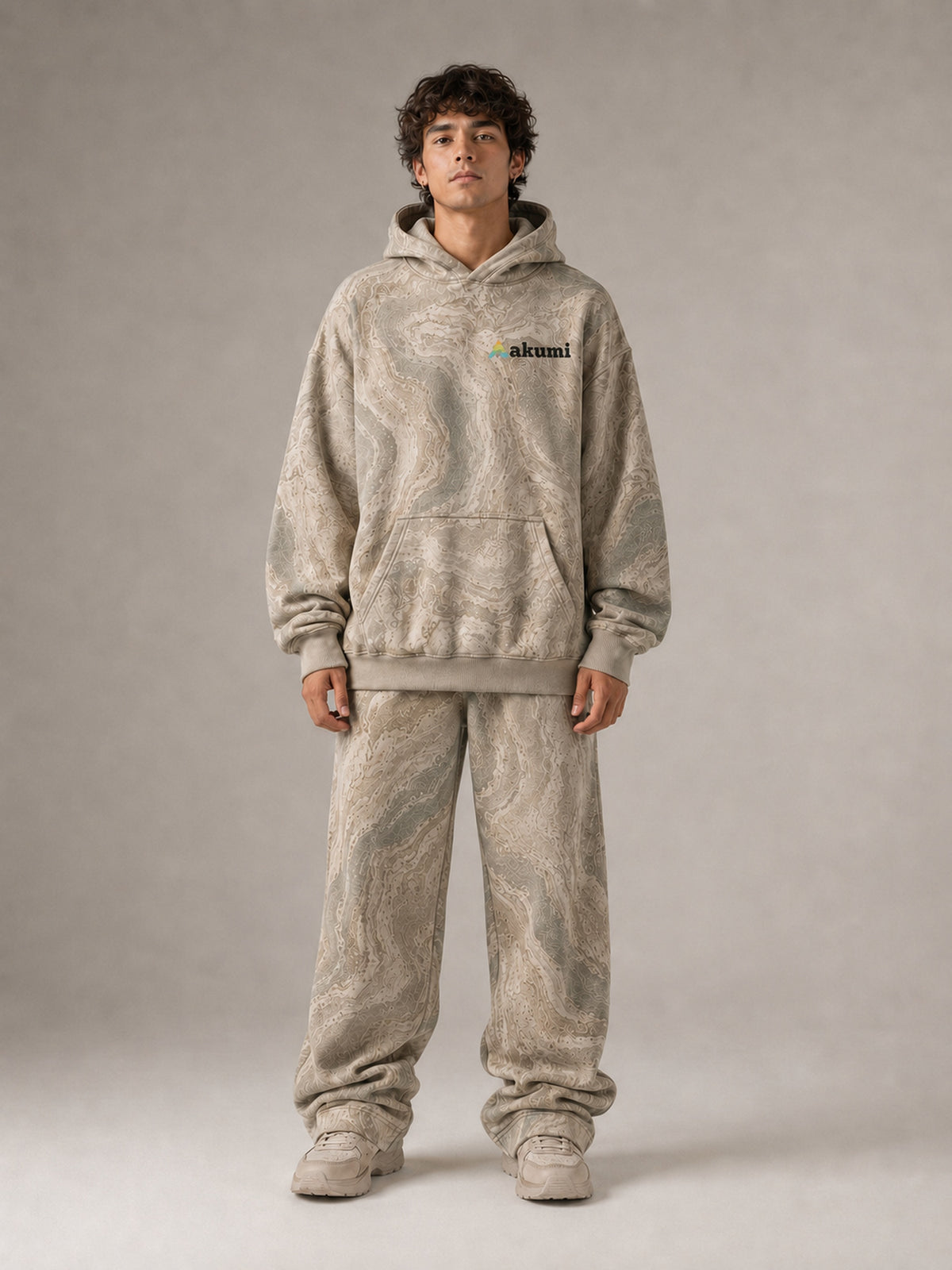 Akumi Fieldwave Hoodie in Stonebrush, male front view with embroidered Akumi logo