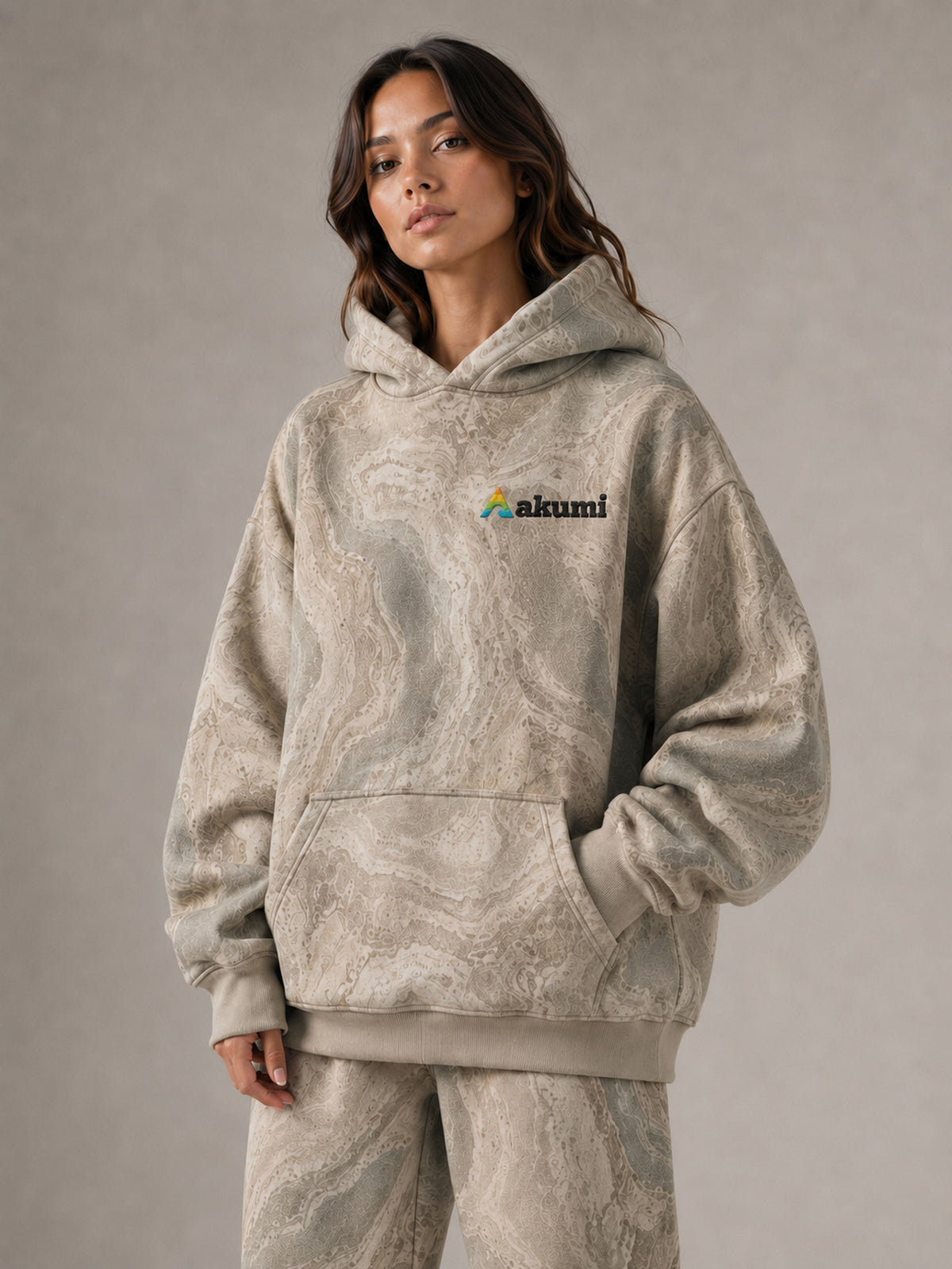 Akumi Fieldwave Hoodie in Stonebrush, logo and kangaroo pocket detail