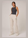 Akumi Flowline Straight-Leg Sweatpant in Soft Oat, front three-quarter view