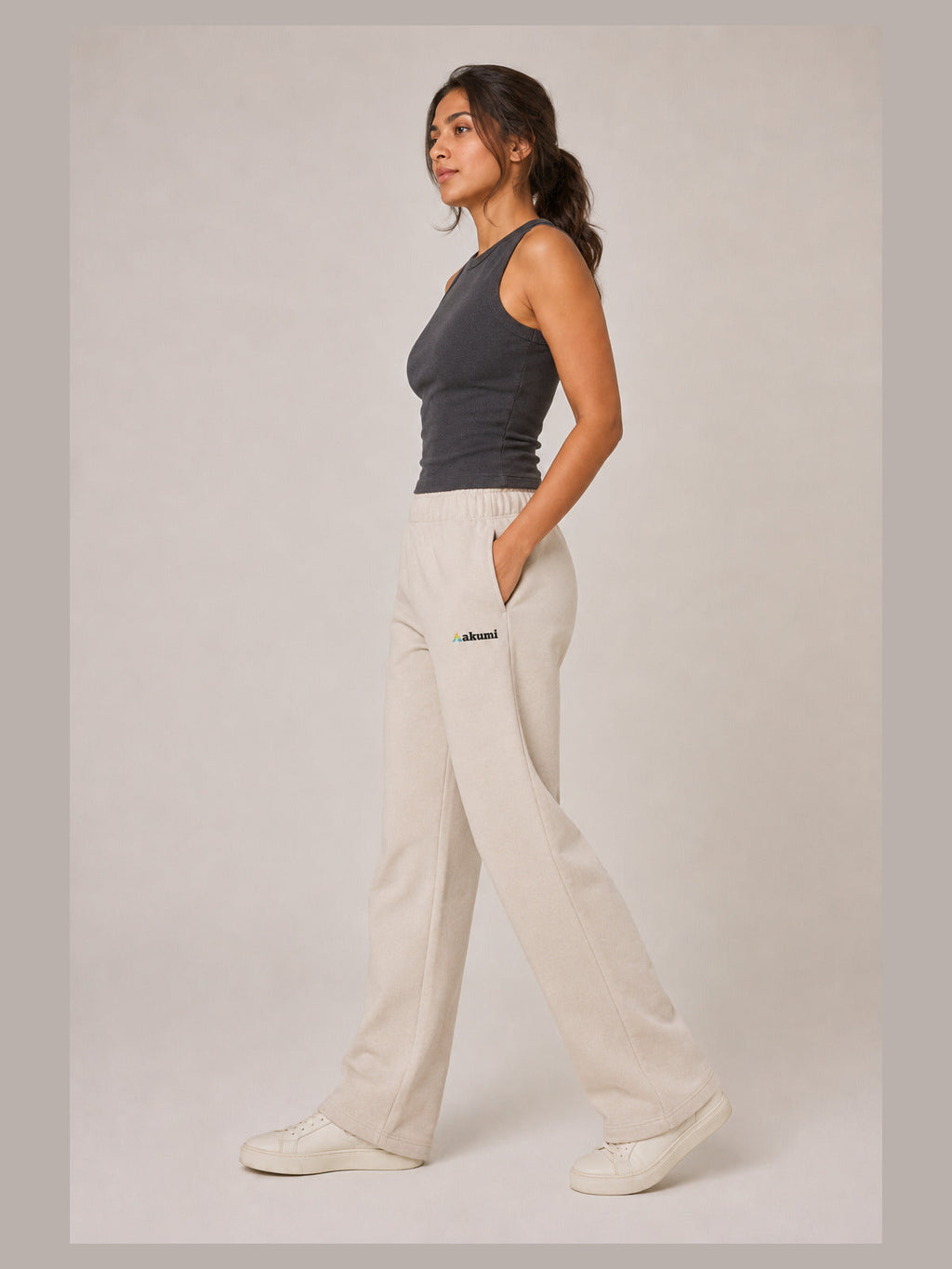 Akumi Flowline Straight-Leg Sweatpant in Soft Oat, side walking view