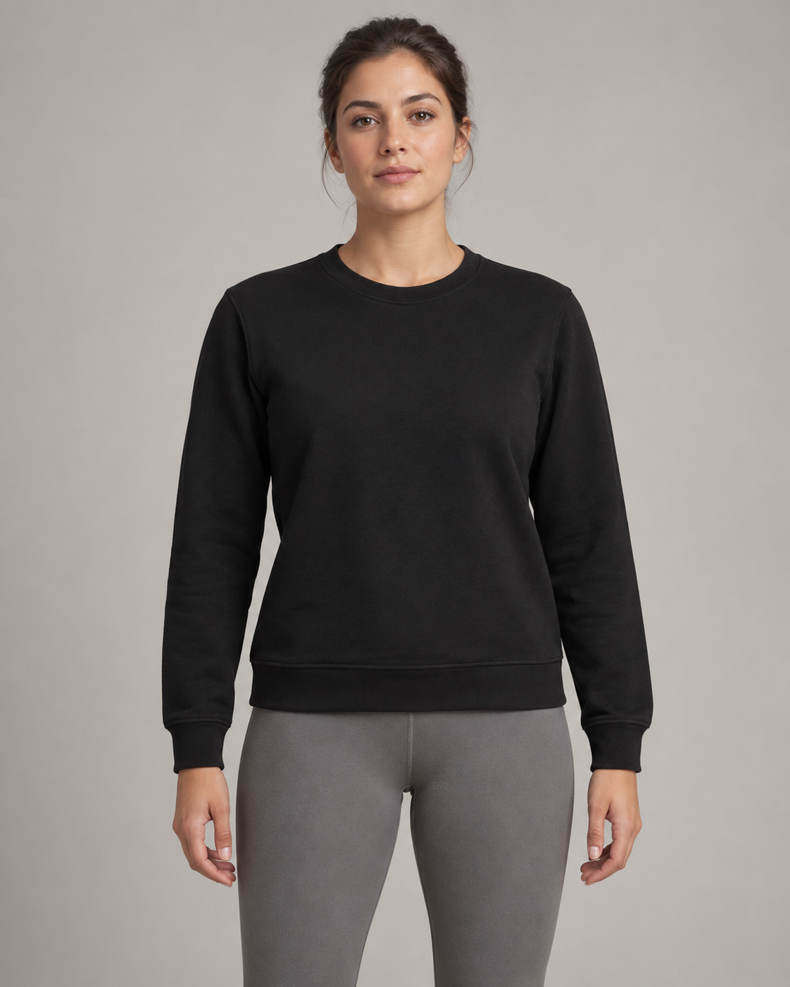 AI-generated design concept: woman wearing the proposed Formline Everyday Crew in Onyx, front view.