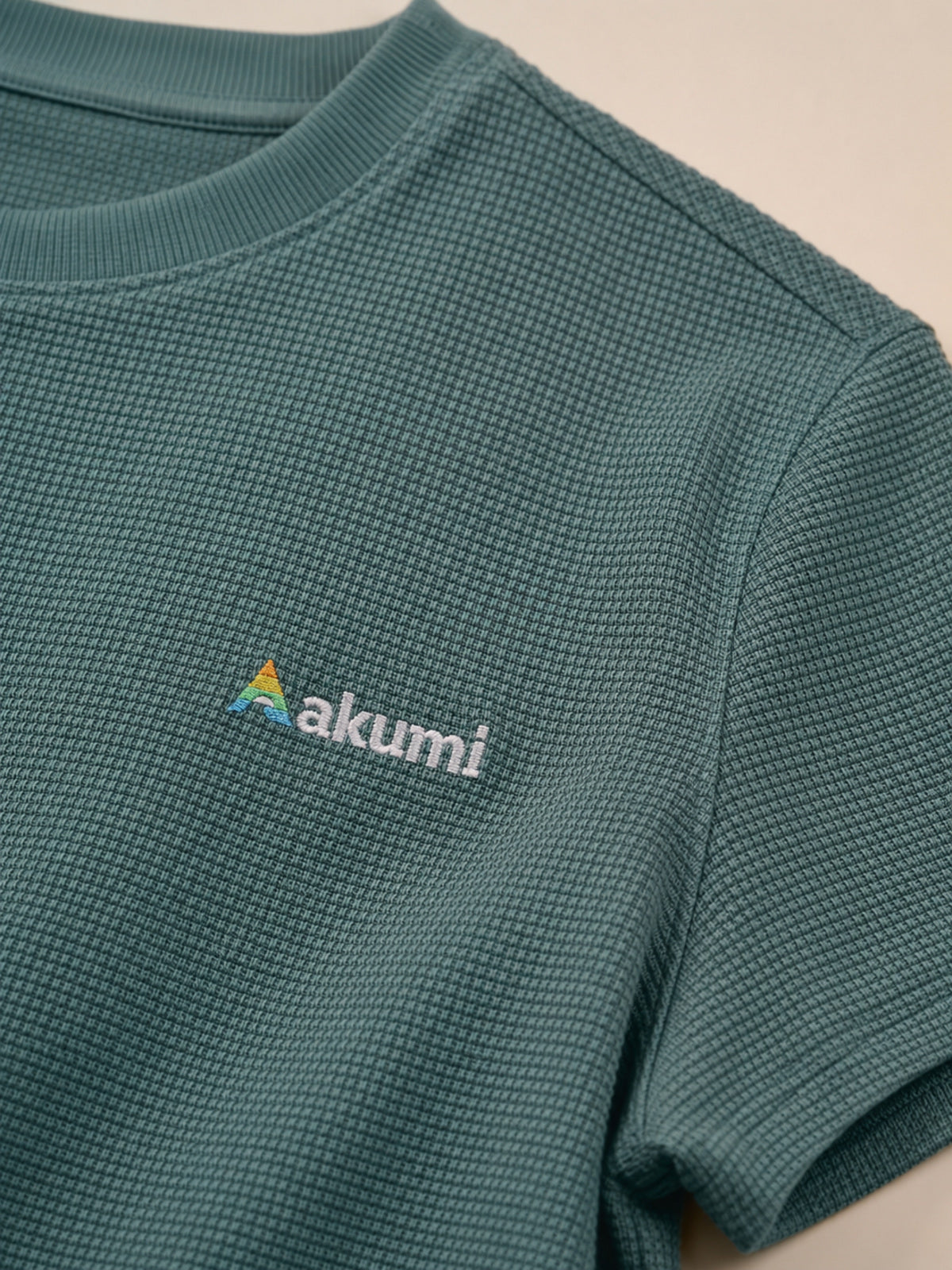 Akumi Gridsoft Waffle Tee in Lagoon Mist embroidered logo and waffle texture detail