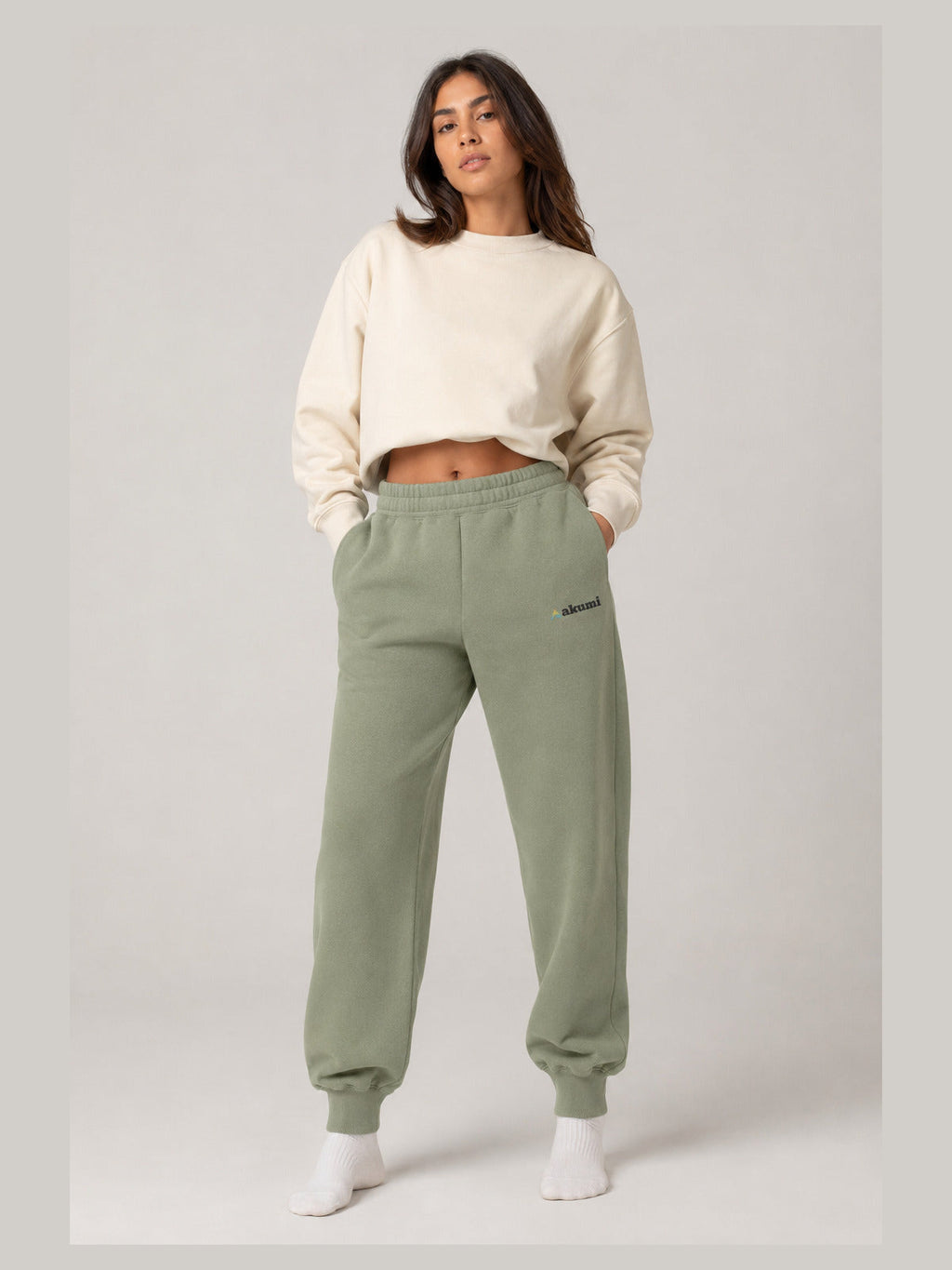 Akumi Groundform Sweatpant in Washed Sage, hero front three-quarter studio view