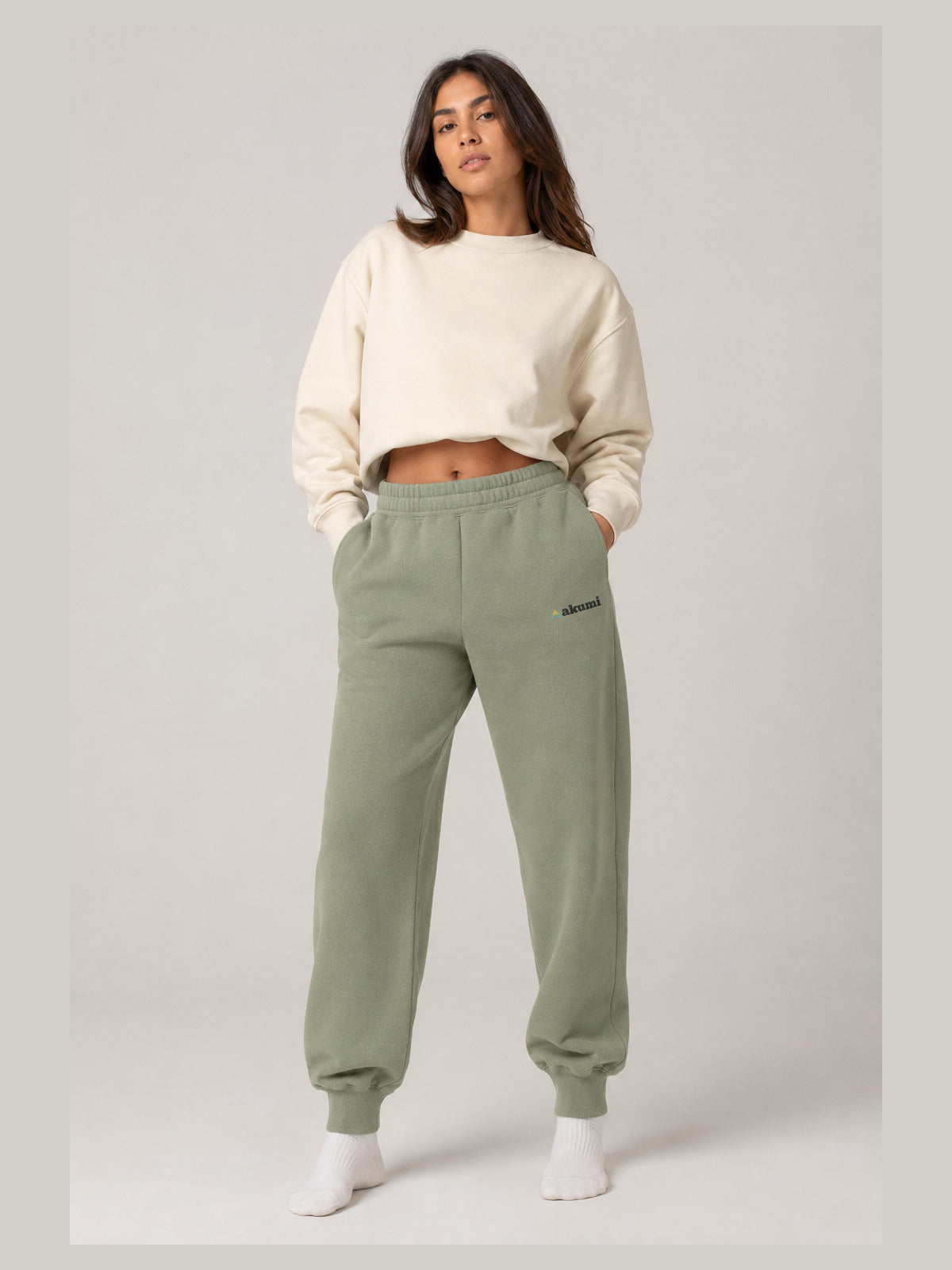 Akumi Groundform Sweatpant in Washed Sage, hero front three-quarter studio view