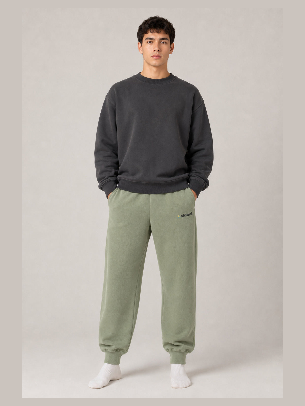 Akumi Groundform Sweatpant in Washed Sage, unisex male front studio view