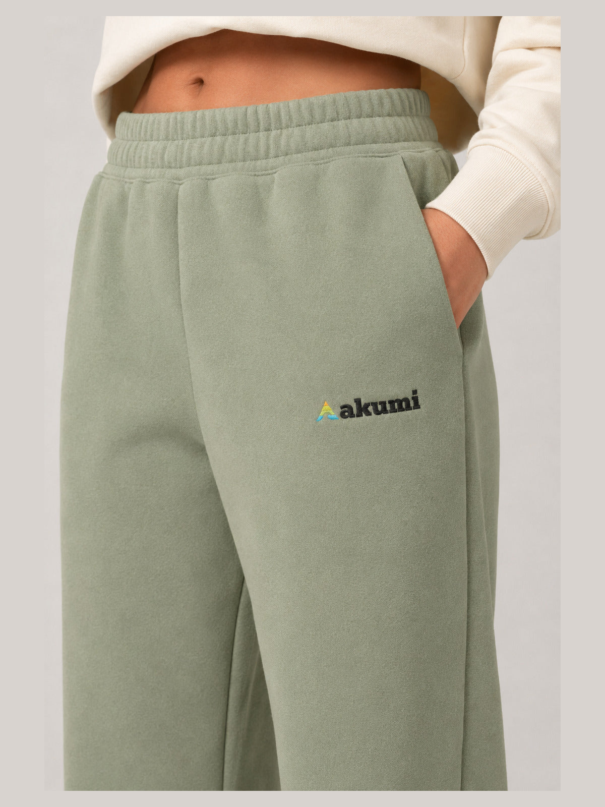 Akumi Groundform Sweatpant in Washed Sage, waistband pocket and embroidered logo detail