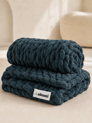 Akumi Groundloop Weighted Blanket Deep Harbor folded view with sewn woven hem label