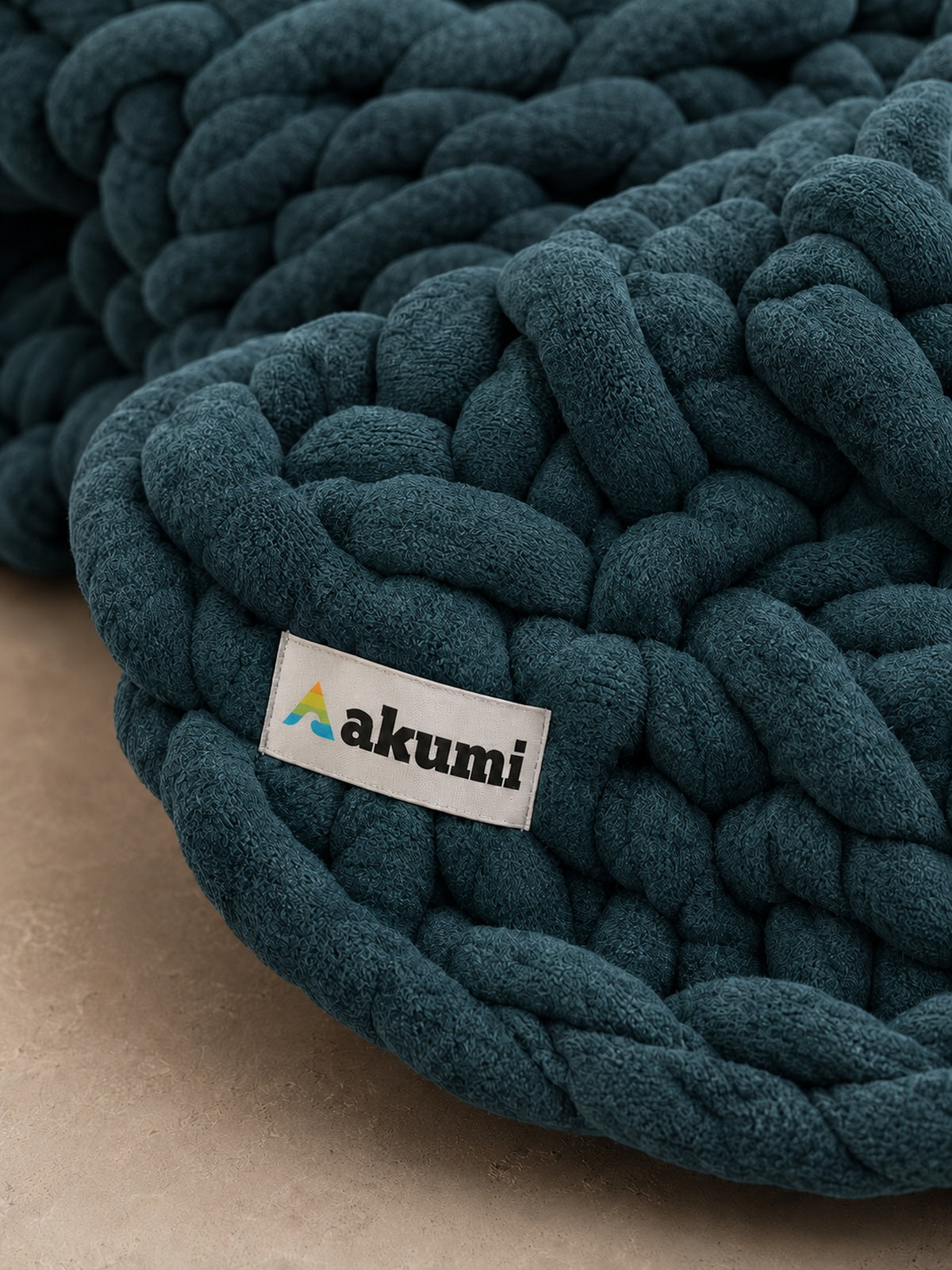 Akumi Groundloop Weighted Blanket Deep Harbor close-up woven hem label detail