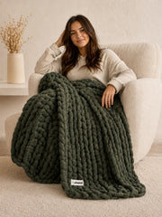 Akumi Grovehold Weighted Blanket Evergreen Ash hero view with sewn woven hem label