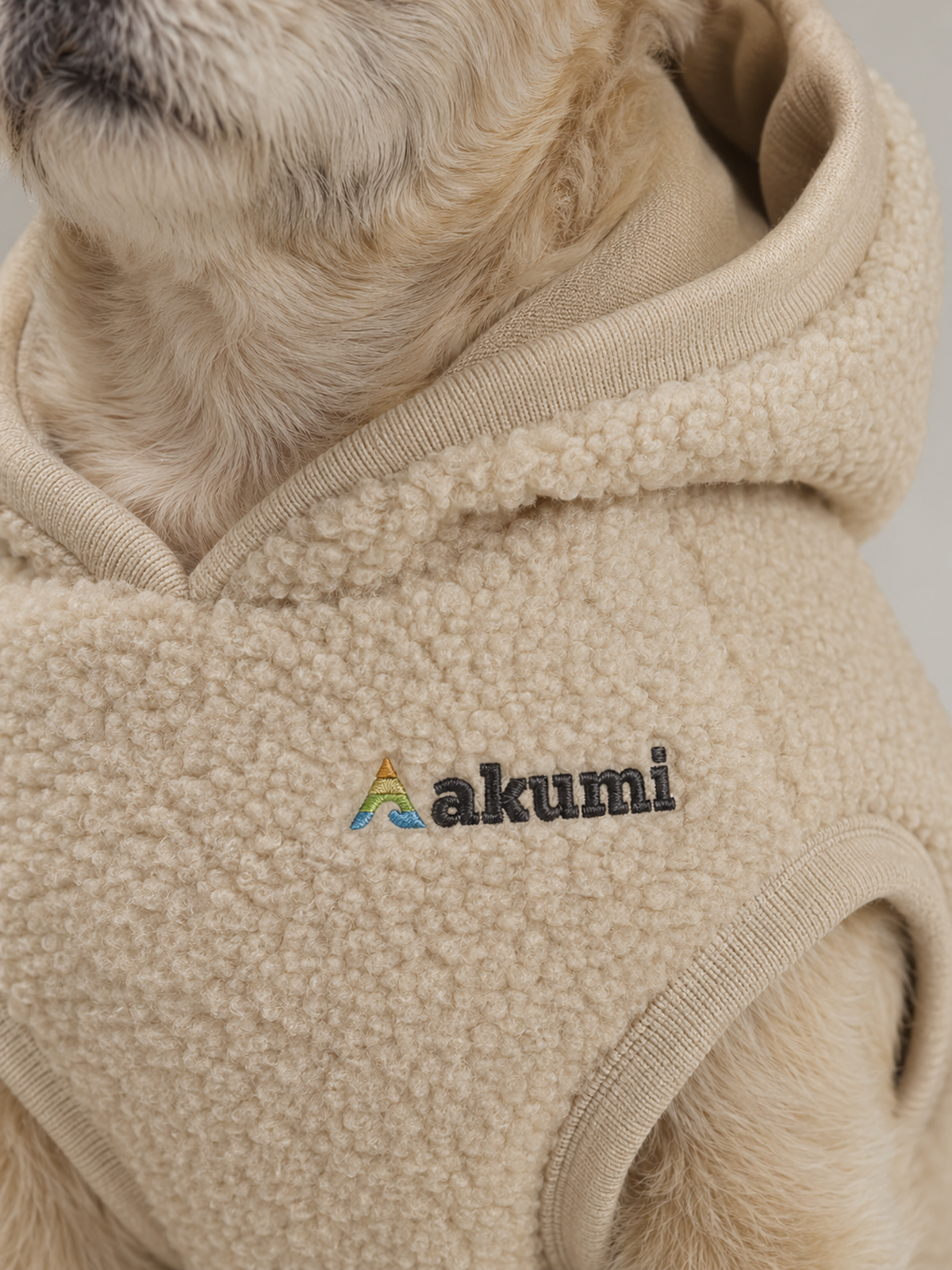 Akumi Hearthcurl Pet Hoodie in Oat Sherpa matching raised embroidered logo and sherpa detail