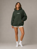 Akumi Hushweight Hoodie in Ash Pine female front three-quarter studio view