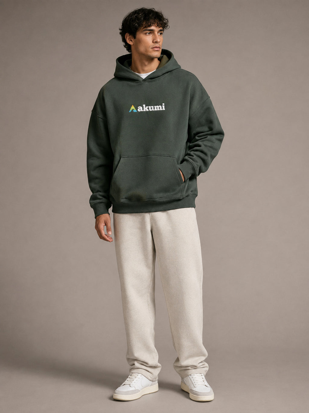 Akumi Hushweight Hoodie in Ash Pine male full-body front three-quarter studio view