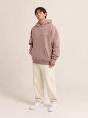 Akumi Layover Rest Hoodie in Terminal Rose hero studio look