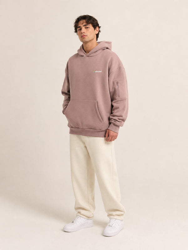 Akumi Layover Rest Hoodie in Terminal Rose hero studio look