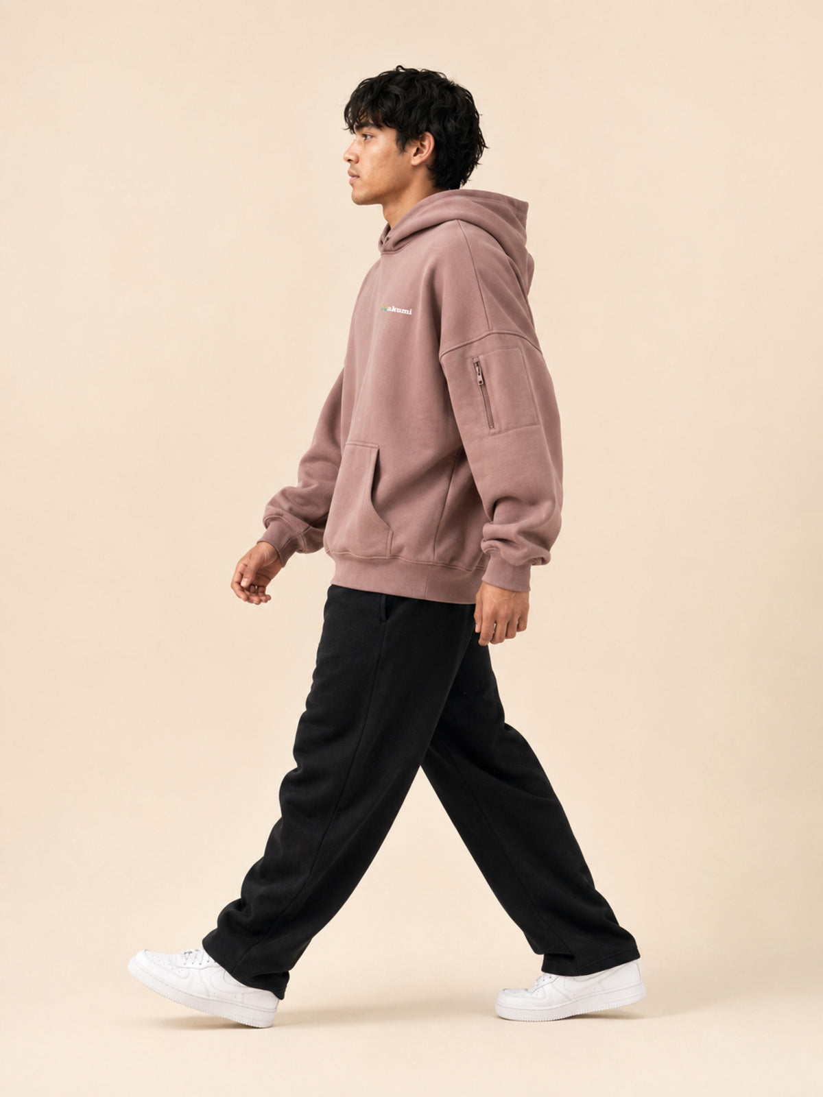Akumi Layover Rest Hoodie in Terminal Rose side view with sleeve pocket