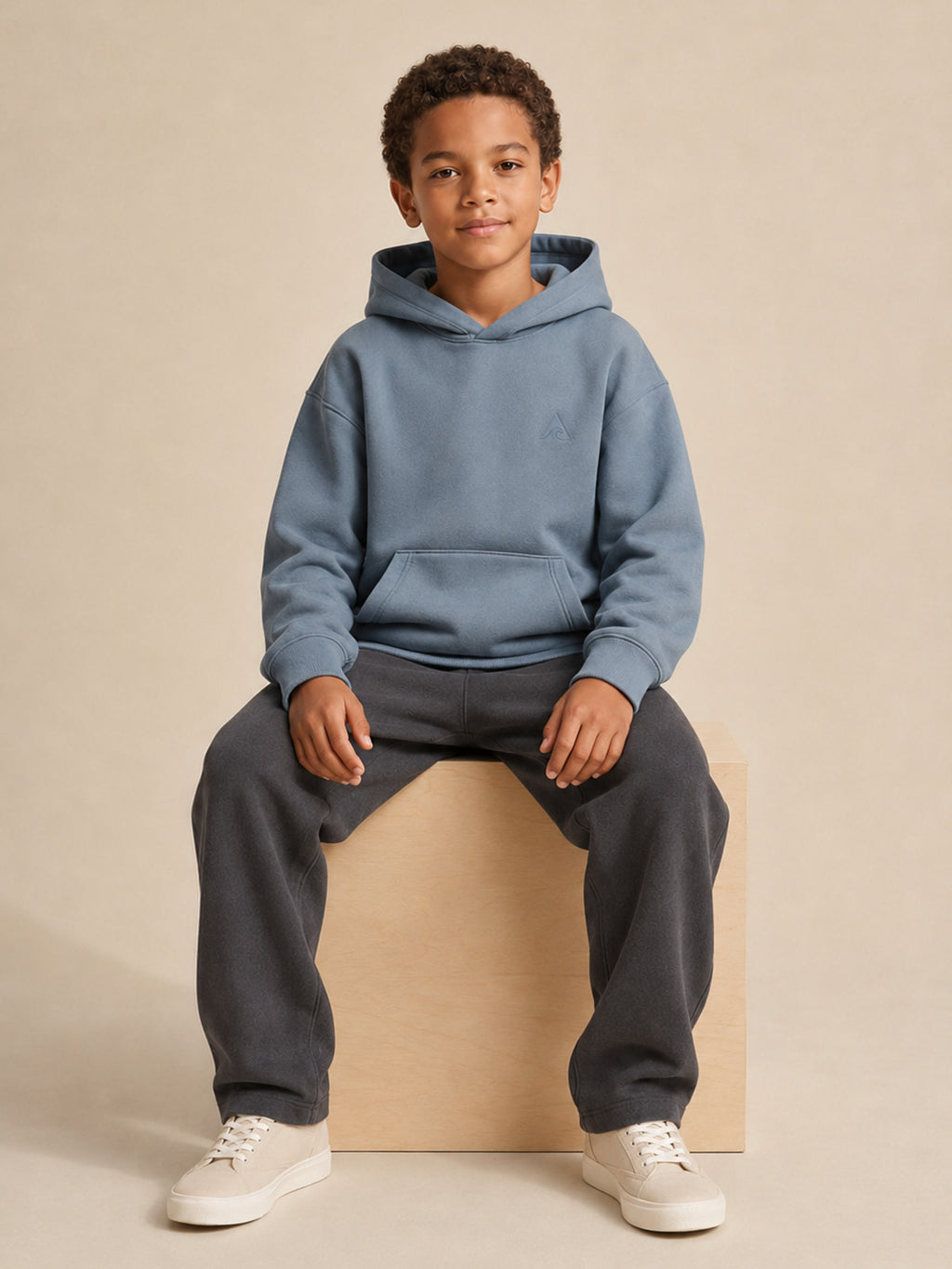 Akumi Little Current Kids Hoodie in Pacific Mist, seated fit view